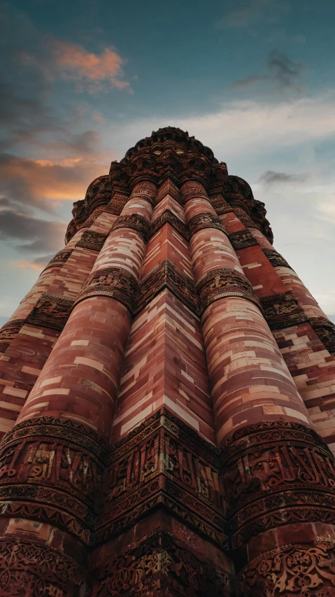 a red brick tower with intricate decorations on it