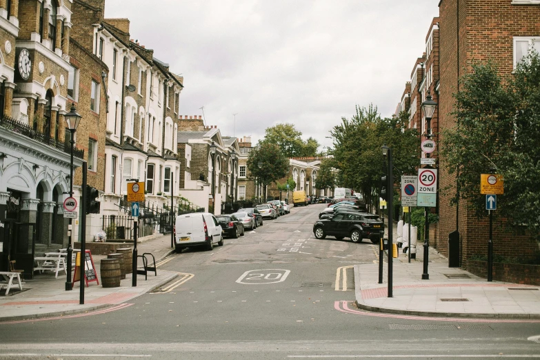 a couple of cars are parked in the street