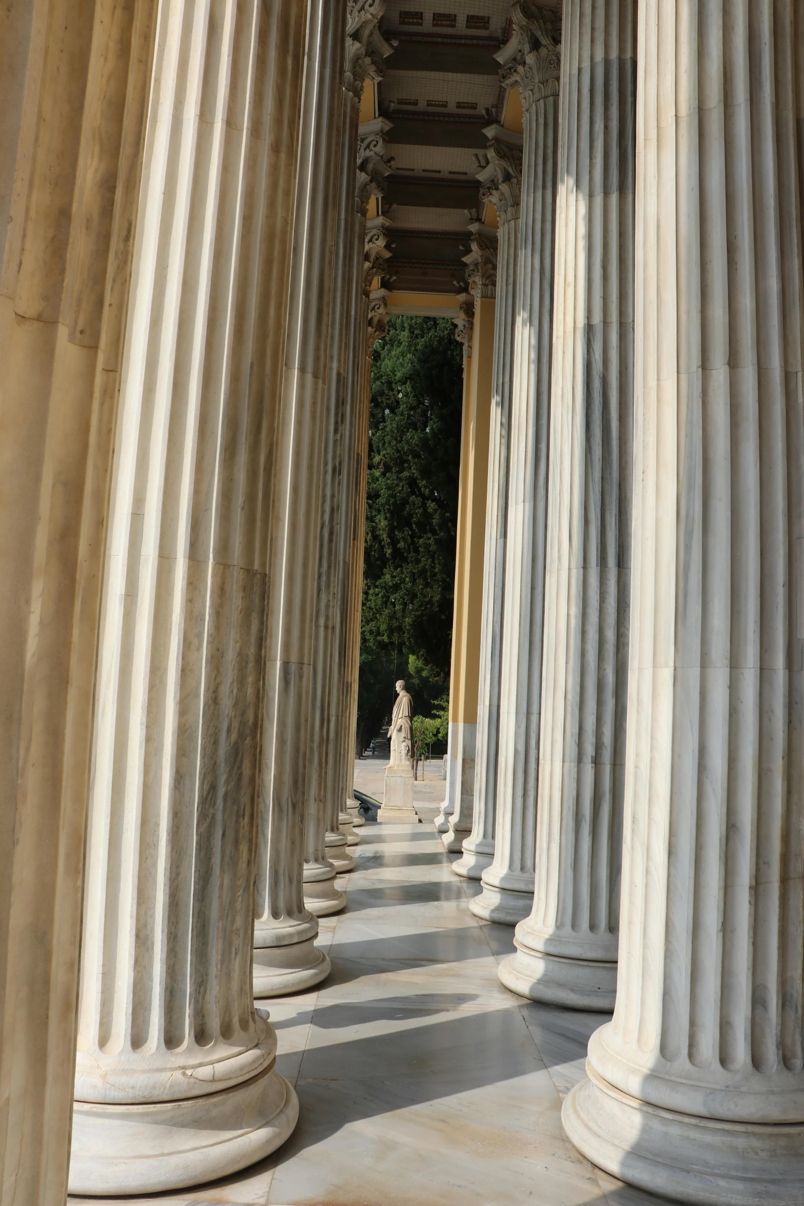 columns line the walkway on a sunny day