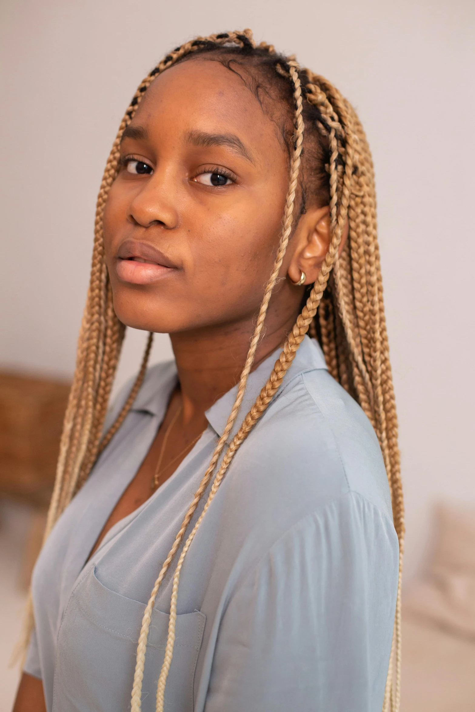 an african american girl with her long cornrows