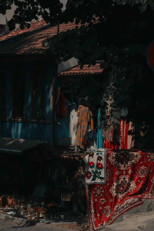 a collection of decorative items hanging on a roof next to a building