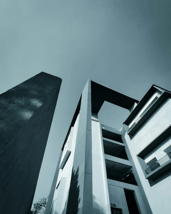 a tall building next to another building with windows