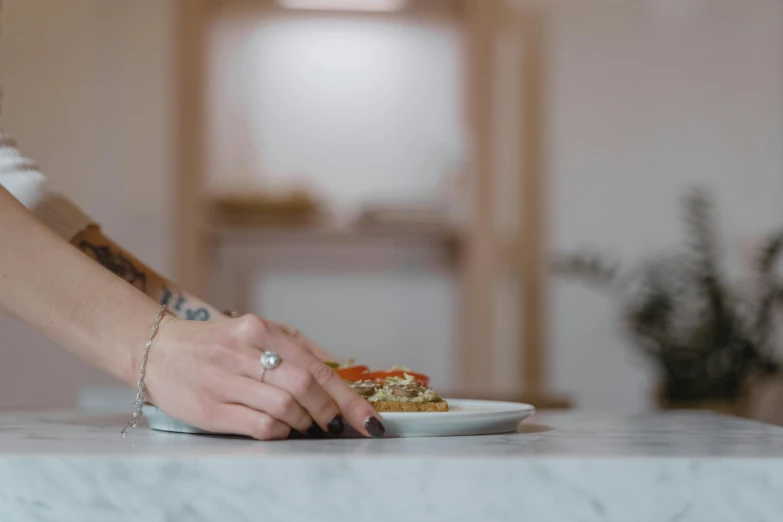 the woman is eating dinner on her plate