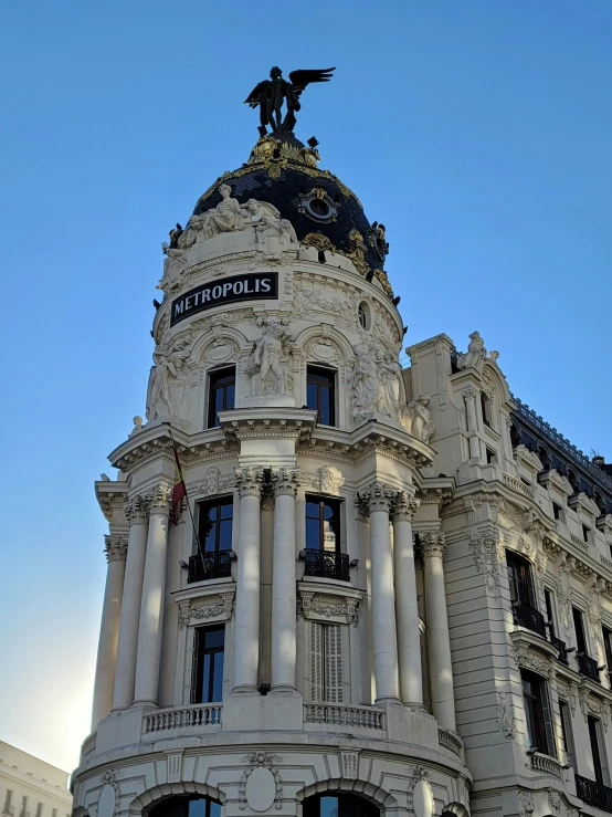 a white building with statues on top of it