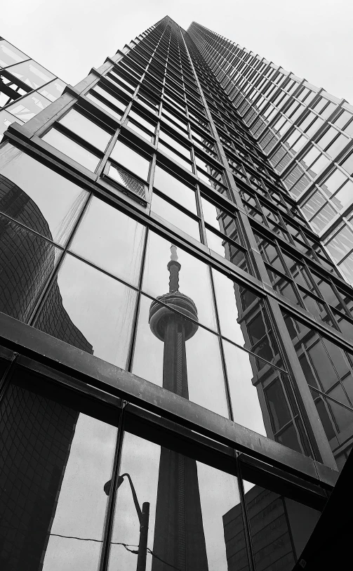 the view of the building has its reflection in the glass