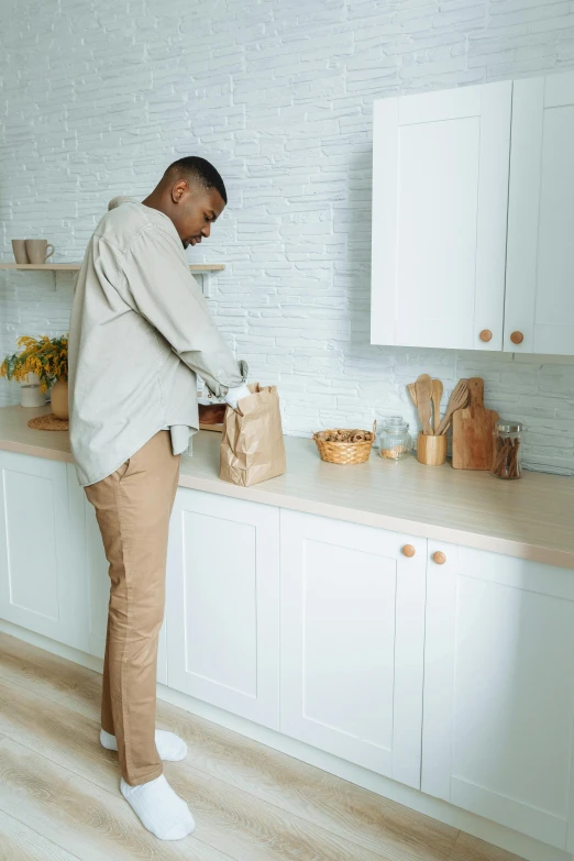 an african american man in a kitchen setting