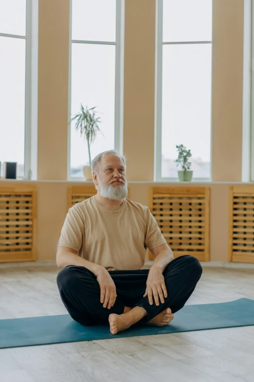 a man is doing yoga in a room