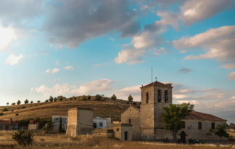 an abandoned church sitting on top of a hill