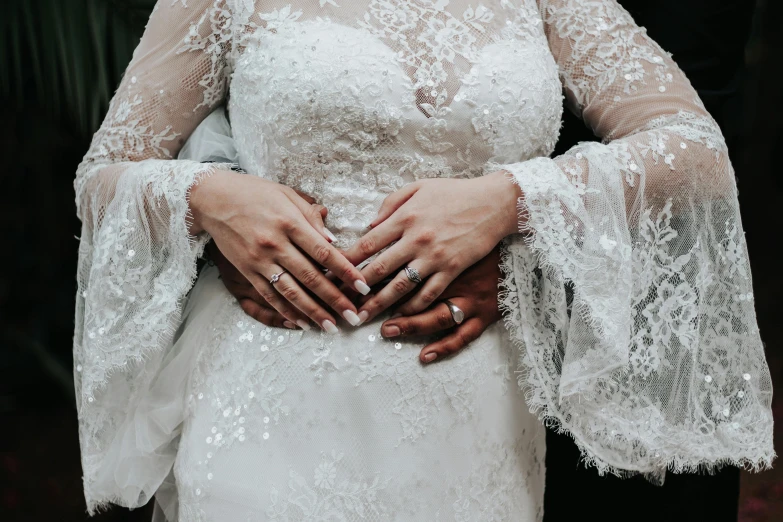 bride and groom in wedding dress posing together