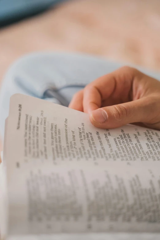 an open book sitting on top of a person's lap