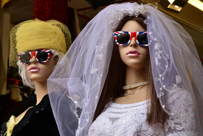 mannequins wearing sunglasses and wigs for sale