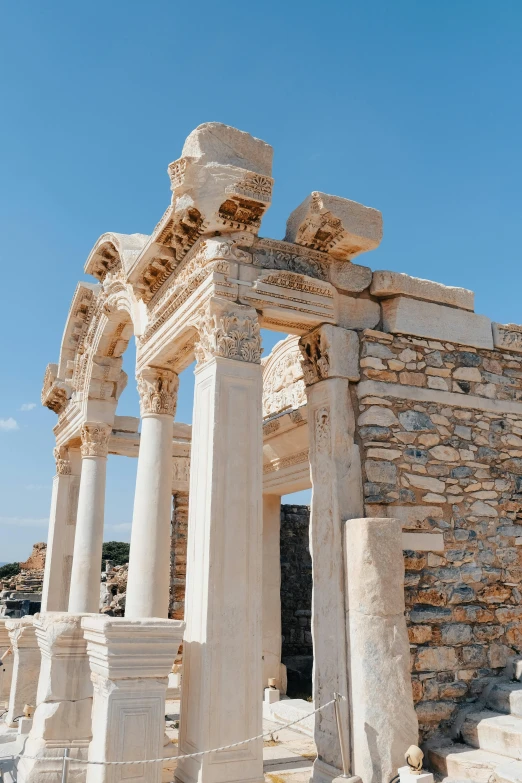 some pillars in front of a stone building