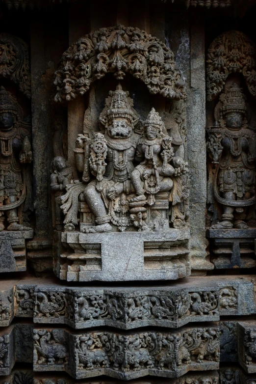 a decorative stone sculpture on the wall of a building