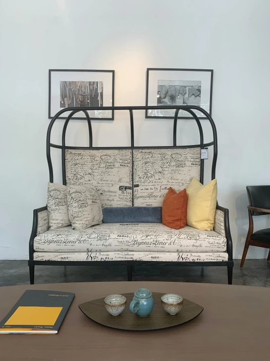 a living room with an old - style sofa, and two chairs