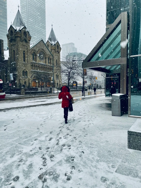 a person walking on the street in the snow