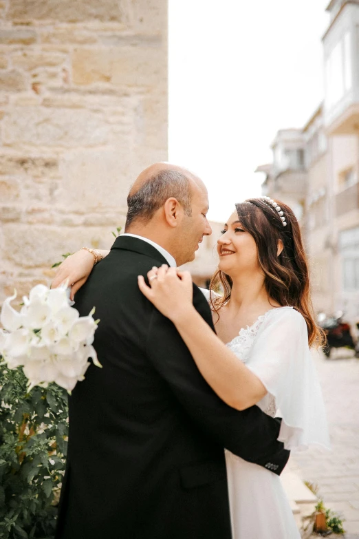 a man and woman are posing for pictures