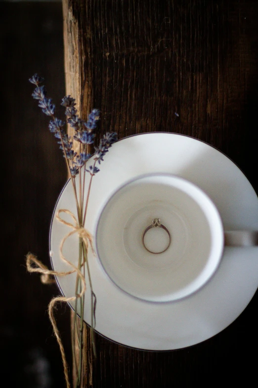 there is a small bouquet in the white bowl