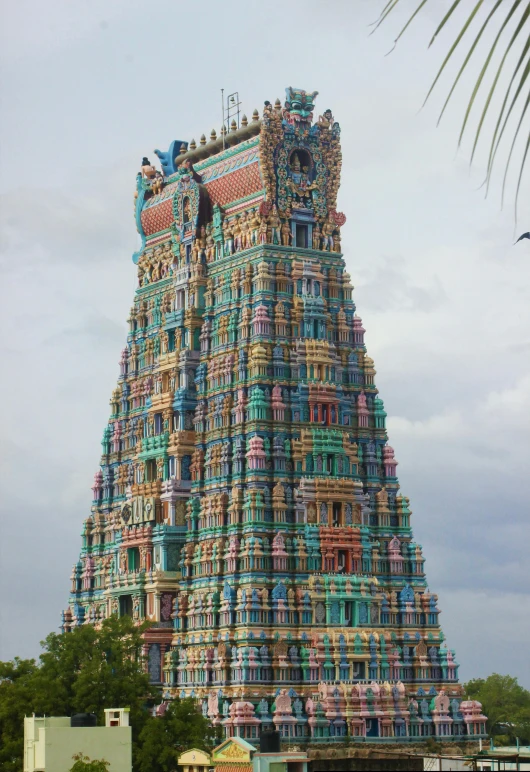 large decorative statue in front of a very tall building