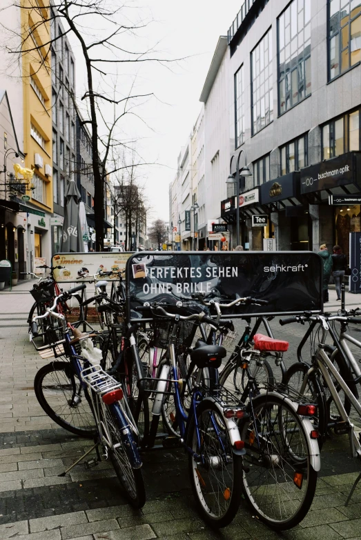 bicycles are parked outside at a bike rack