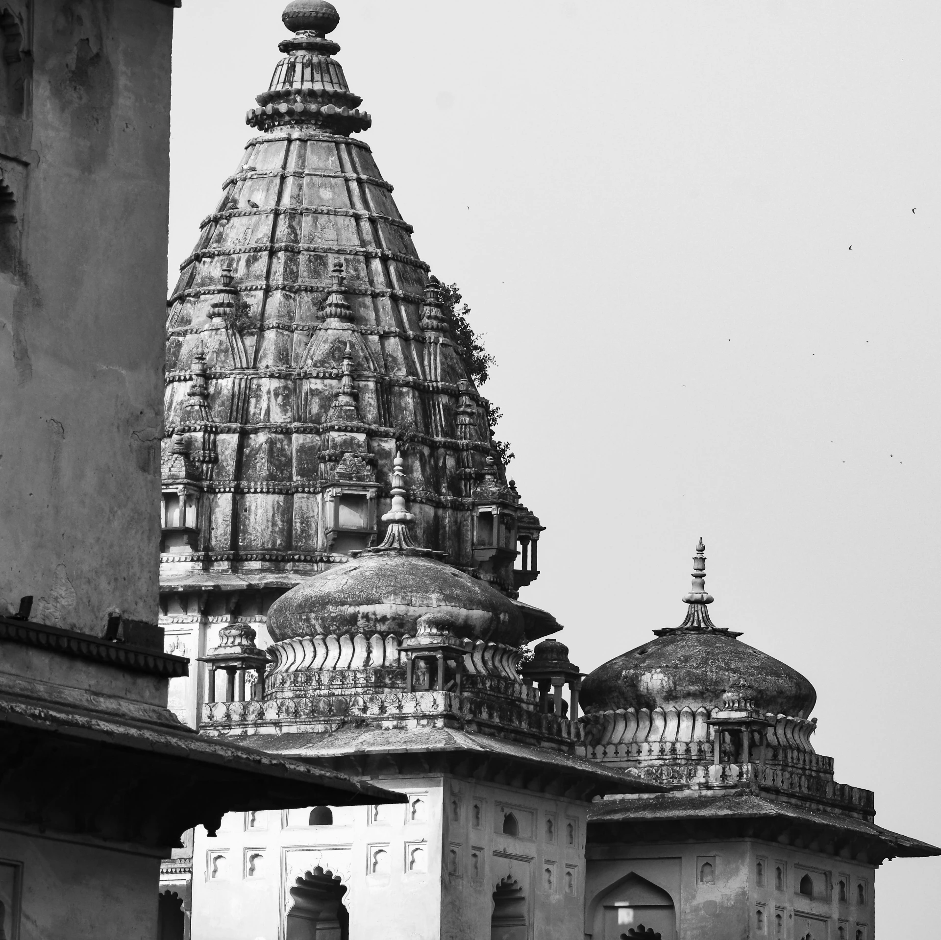 a large building with a dome and a clock on the side of it