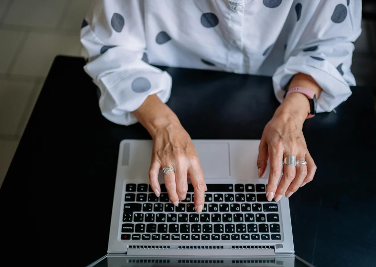 woman typing on a computer in an office