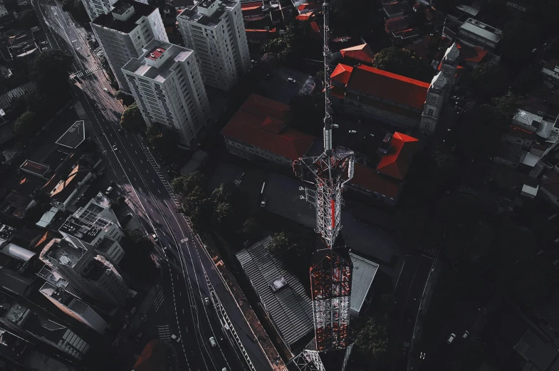 an aerial s of a city with an upward view of a large tower