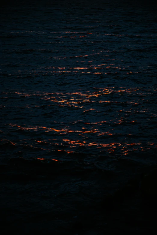 sunset or dusk over the ocean with light reflections