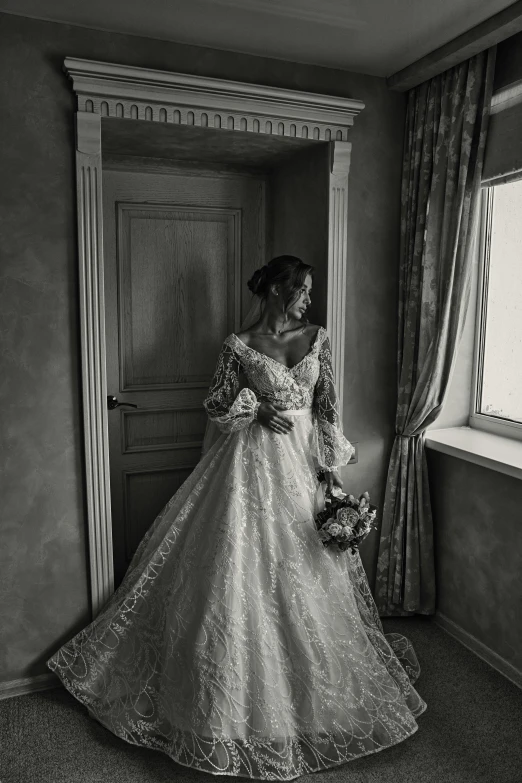 a woman wearing an old fashioned dress in front of a window