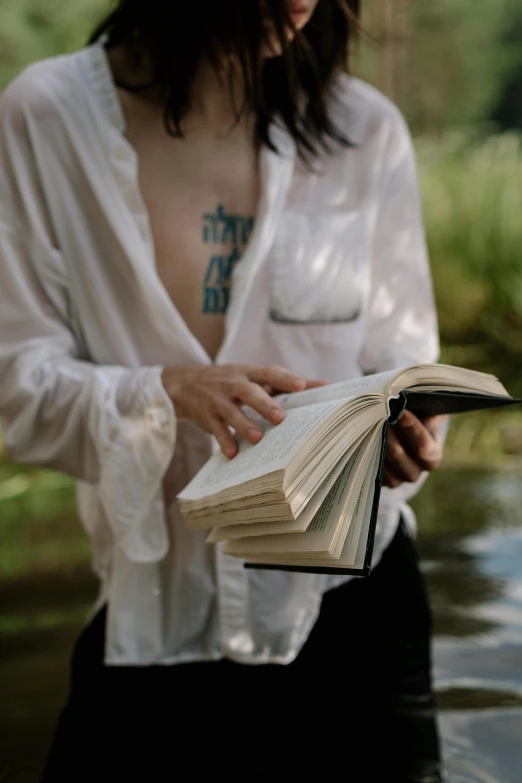 woman holding an open book in her hands