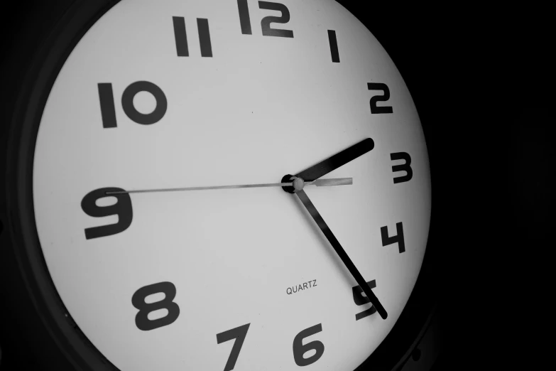 a white clock face on a black background
