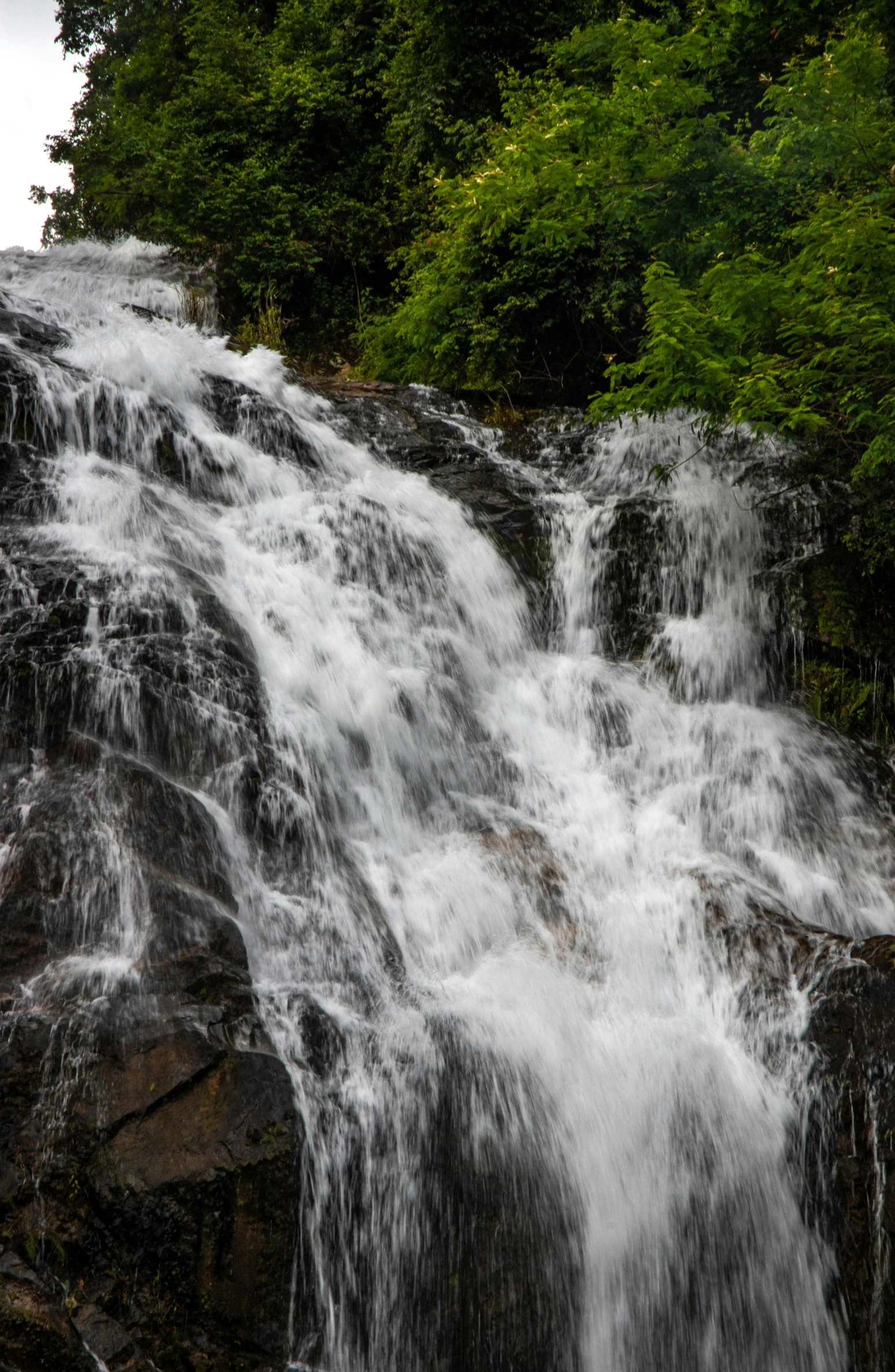 a view of a waterfall in the mountains