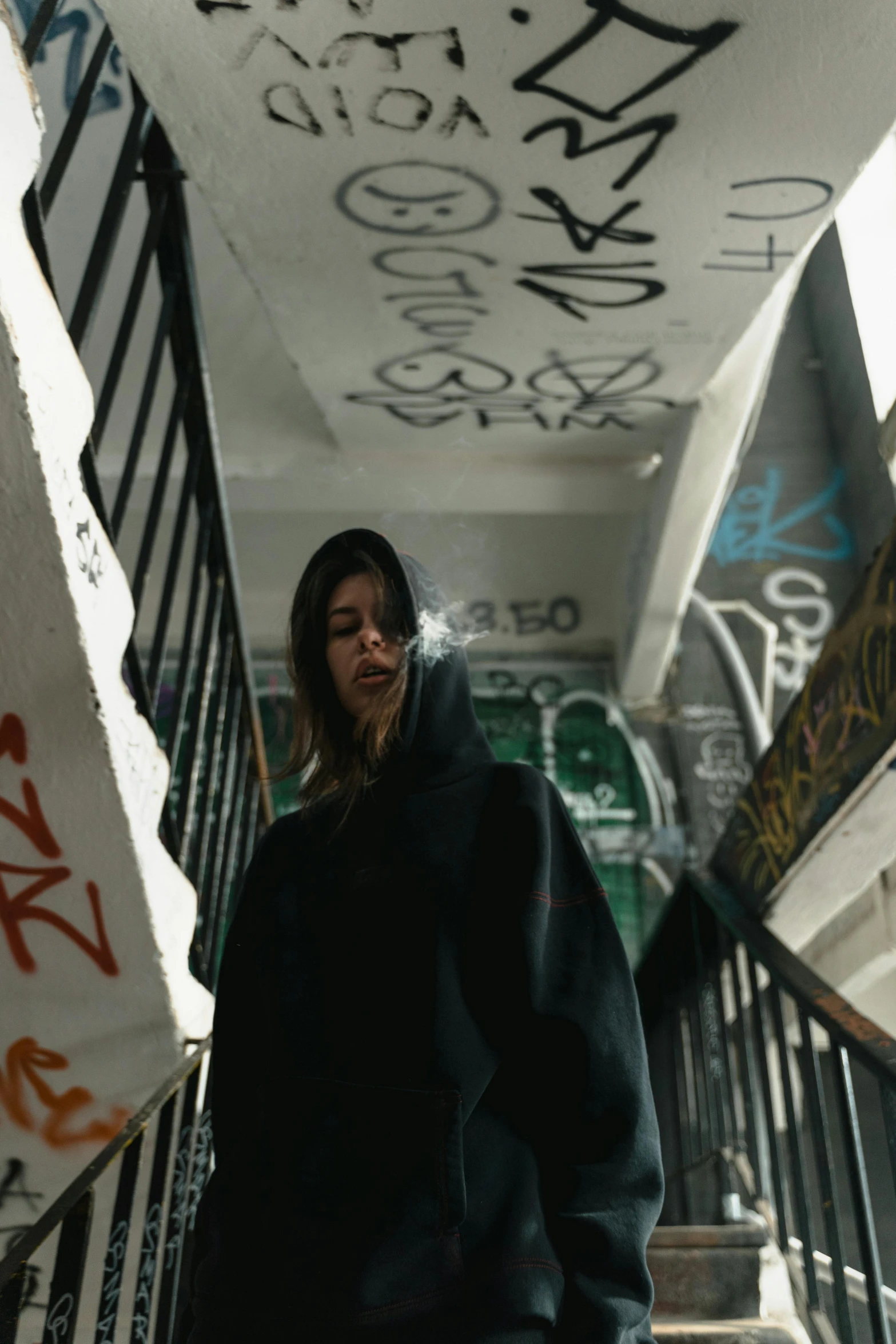 a person standing on the steps of an overpass