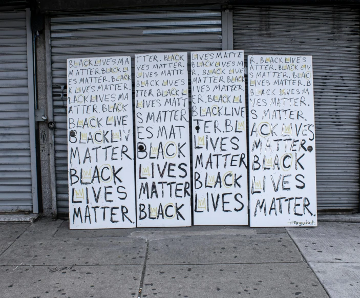 this is a close up po of three white square political signs