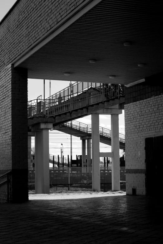 people standing outside at the top of the walkway