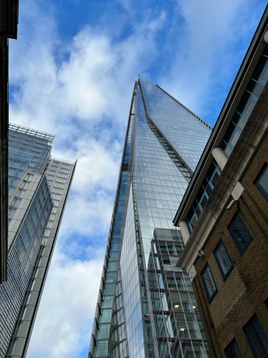 view looking up from ground level at buildings in city