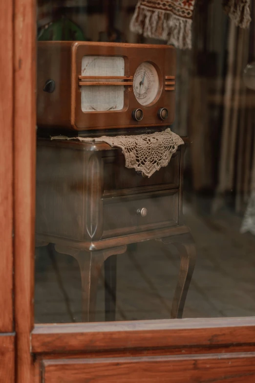 a vintage radio sitting on top of a stand on the street