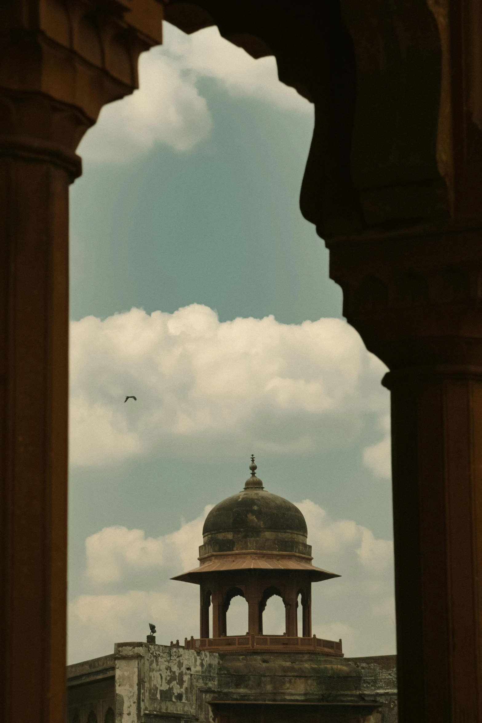 a building with a domed roof and a sky background