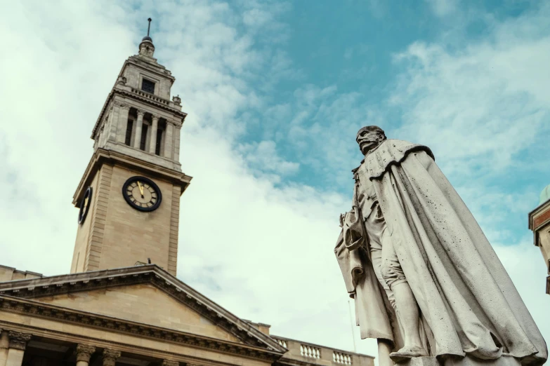 a large tall clock tower sitting above a stone building