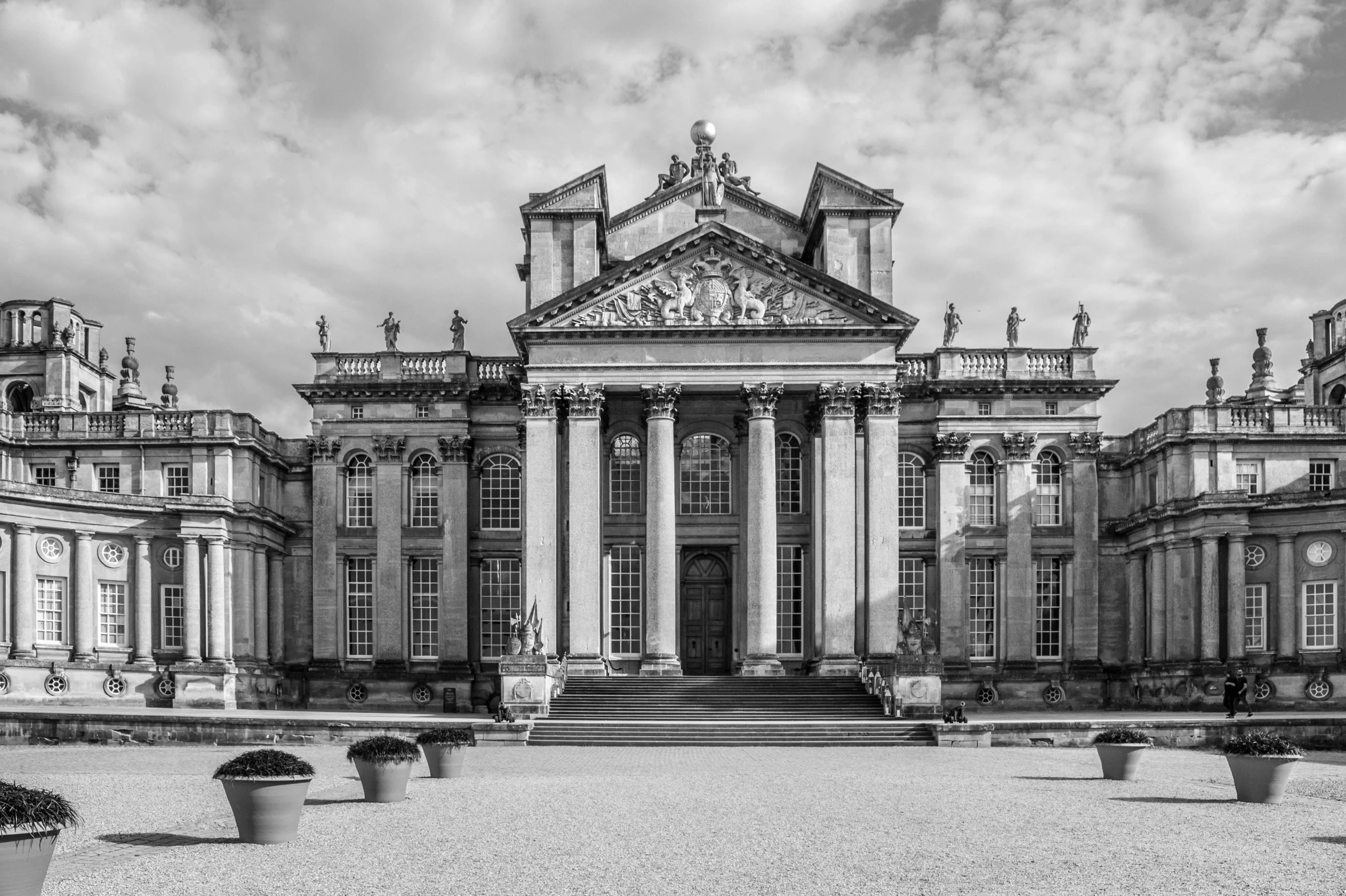 an old looking building with columns and pillars on it