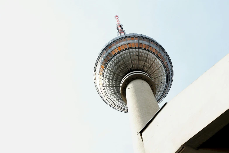 the top of a tower in front of a building