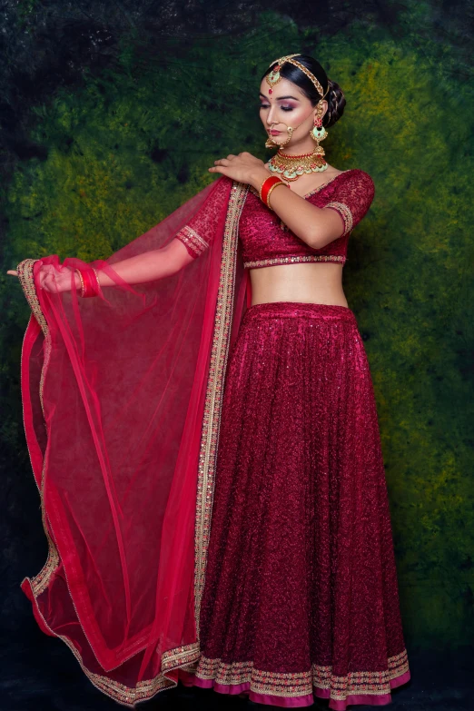 a woman with dark skin is dressed in an indian fashion outfit