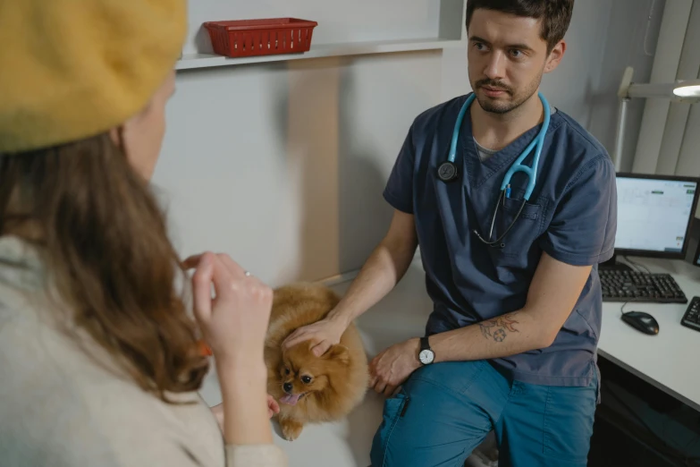 woman with dog in the veterinatic office