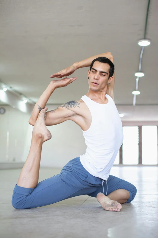 a man doing yoga pose in a room