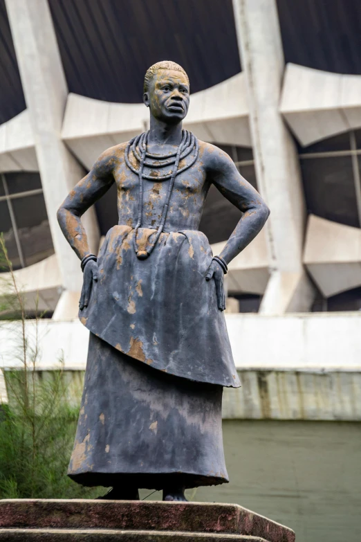 a statue of a man with brown paint on his body