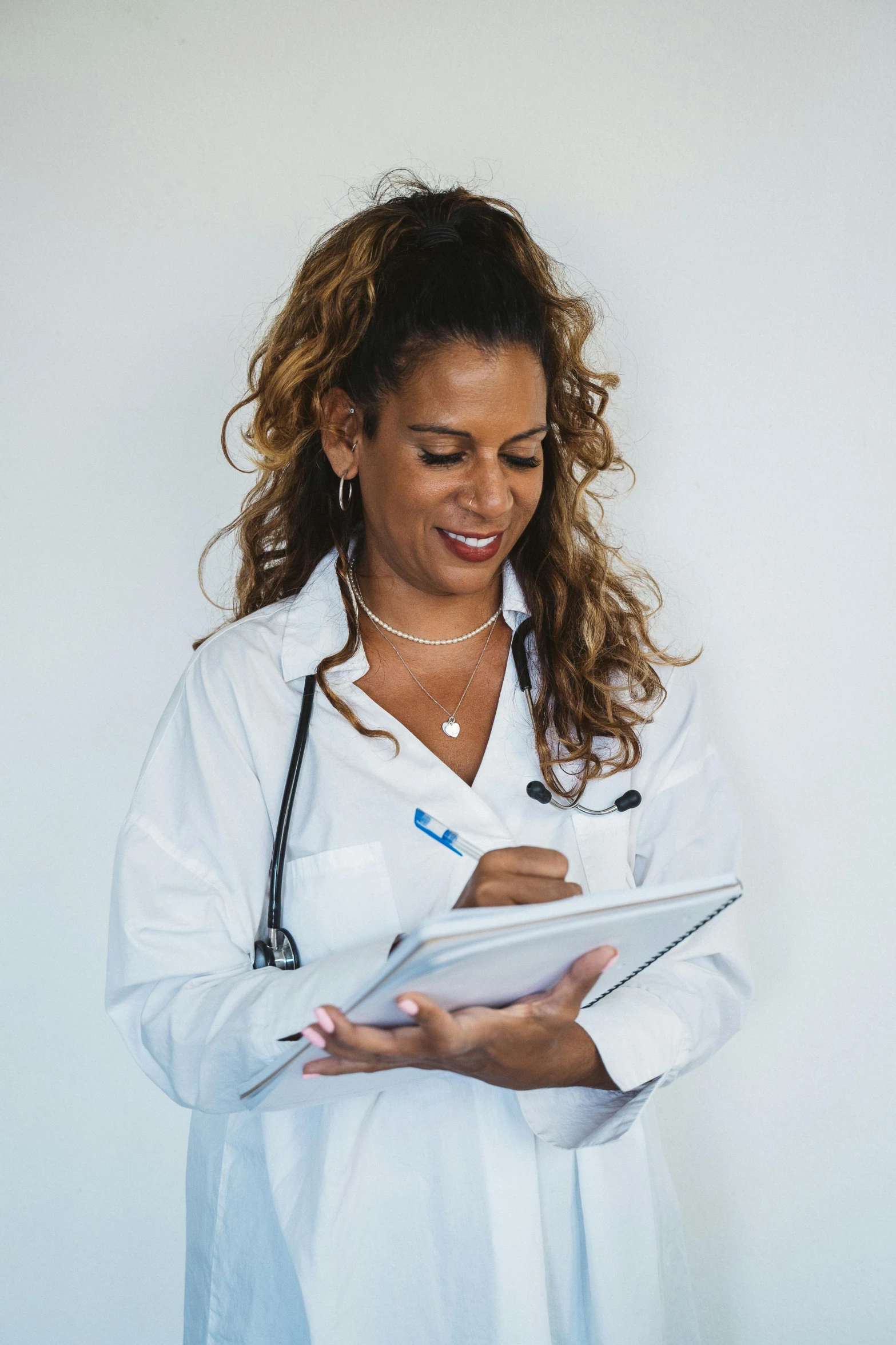 a woman in a white shirt holding a clipboard