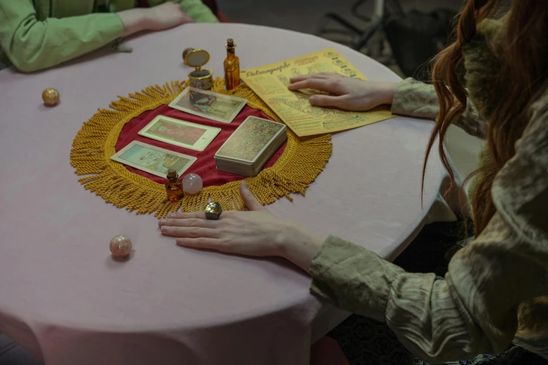 the woman is doing crafts on the table