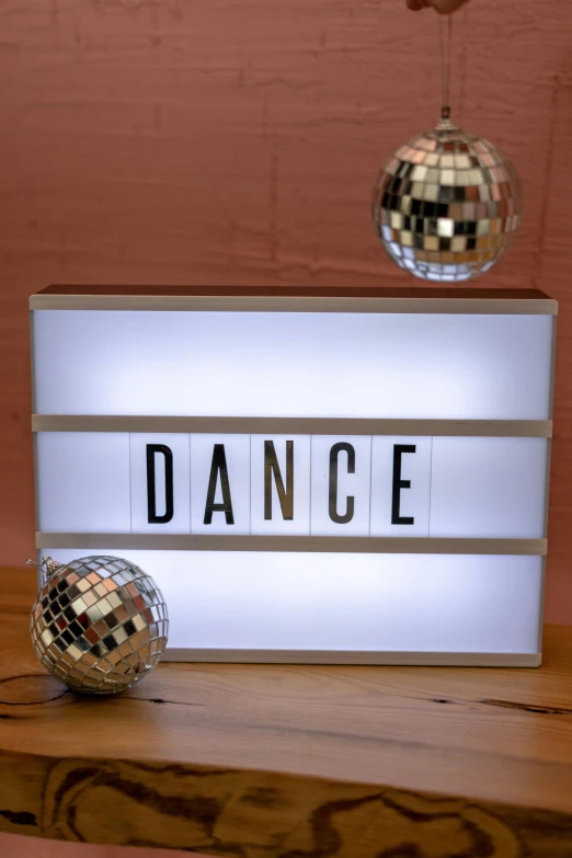 a dance light box is on a wooden table