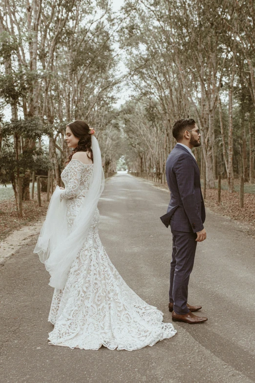 the bride and groom are standing next to each other