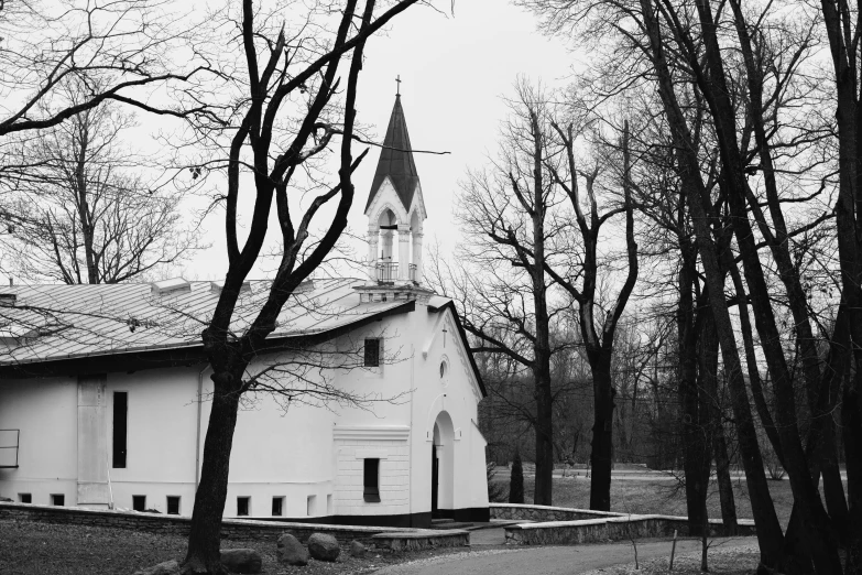 a large white building with a cross in it's center