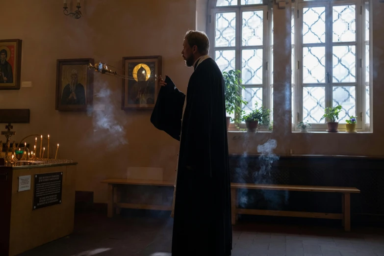 a person standing in a church with smoke coming out of his mouth